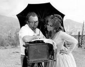 MUNDA: OMAGGIO A SERGIO LEONE, CON  BOZZETTI ORIGINALI COSTUMI DI ”C’ERA UNA VOLTA IL WEST”